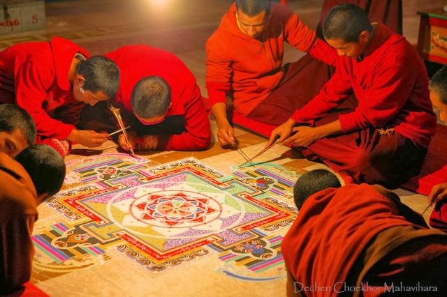 1-Dechen Choekhor Monks in the process of making the Sand Mandala of Chakrasamvara with full concentration.jpg